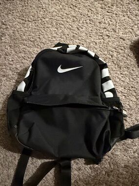 Nike Black Backpack with White Swoosh and Stripe Accents